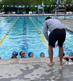 Billy Early coaching swimming